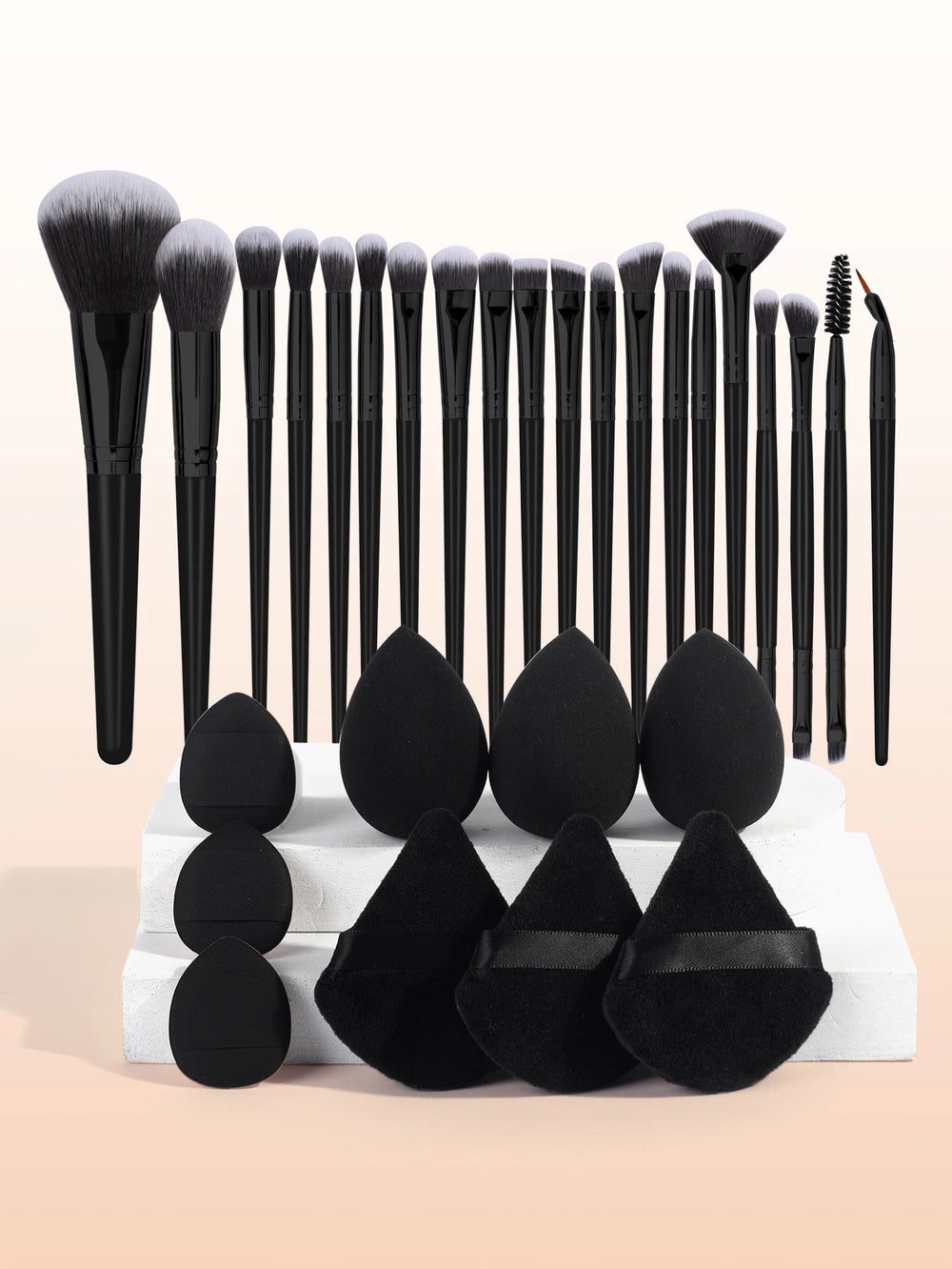 beauty egg sponges with makeup brushes on vanity